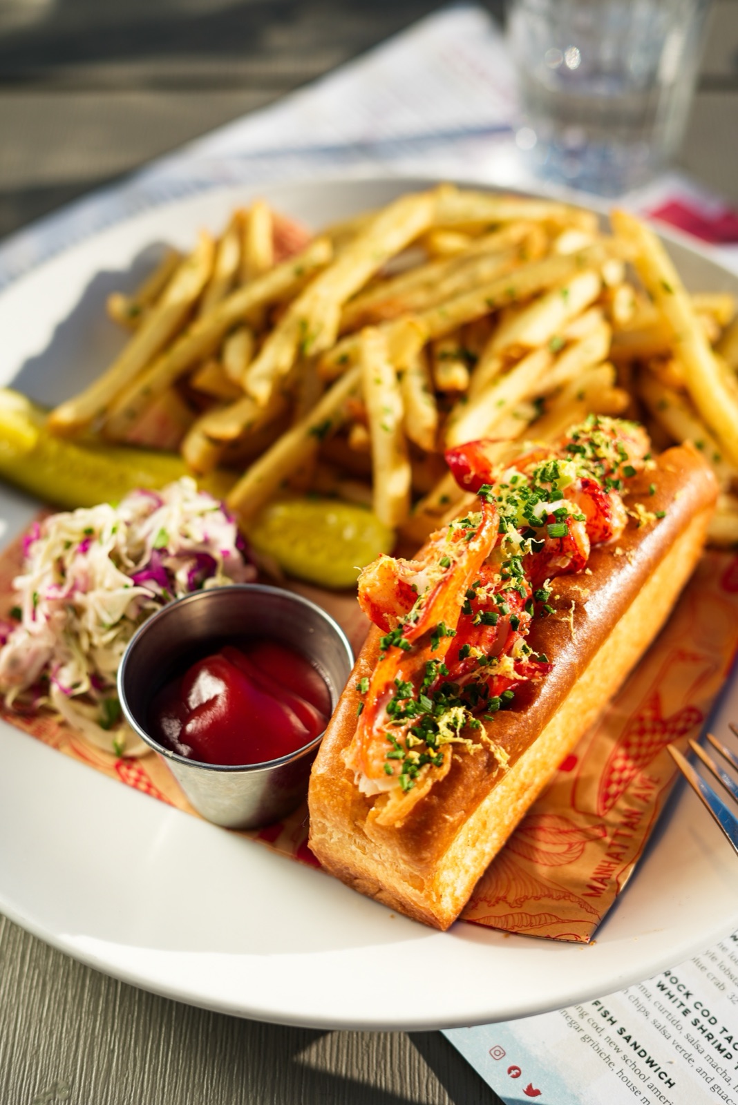 Connecticut lobster roll with fries, slaw and pickles